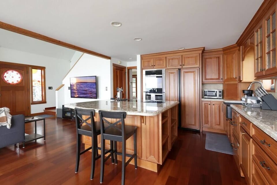 Kitchen island has counter seating for two.