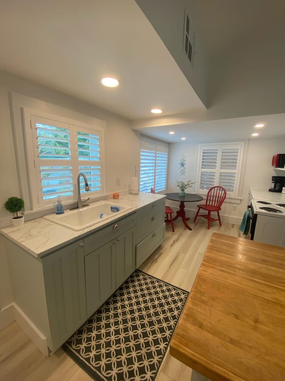 kitchen window overlooking private backyard 