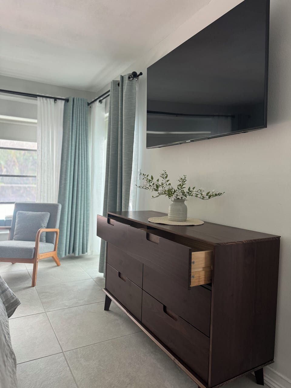 Ample storage for your stay! Spacious dresser and smart TV in the master suite.