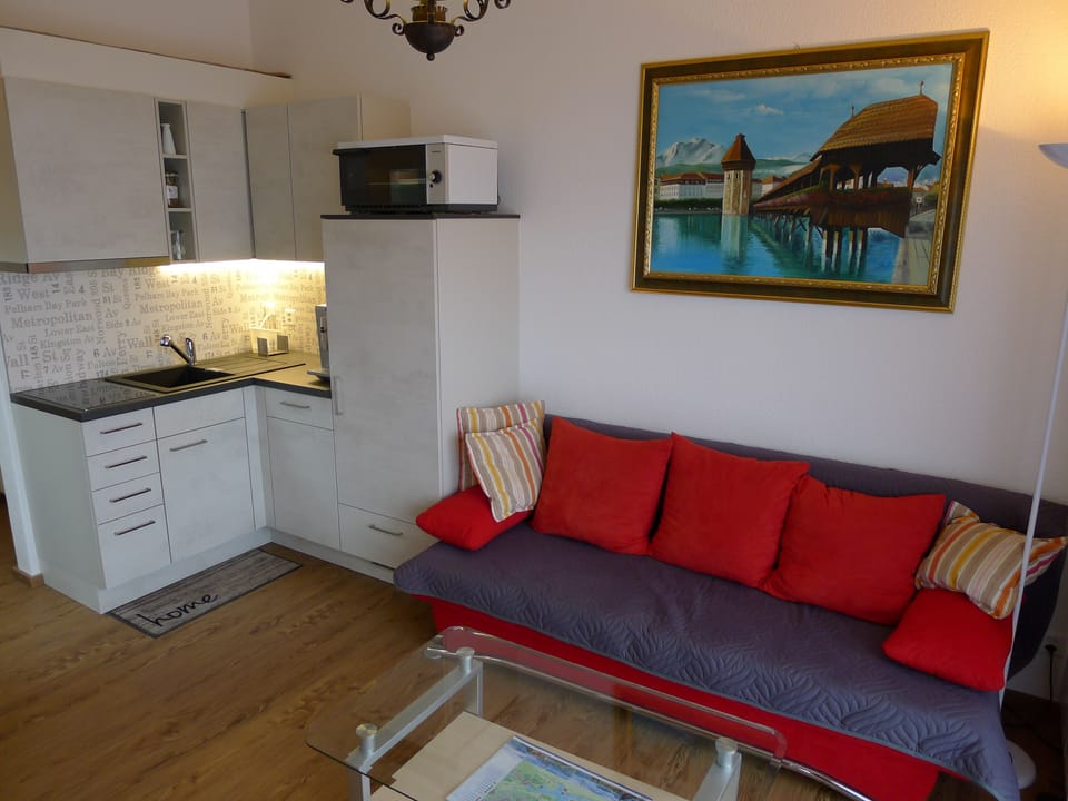 Apartment, 1 Bedroom, Smoking, Balcony | Living area | Books