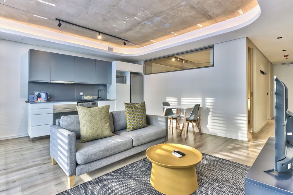 Apartment, 1 Bedroom, Smoking, Balcony | Living room | TV