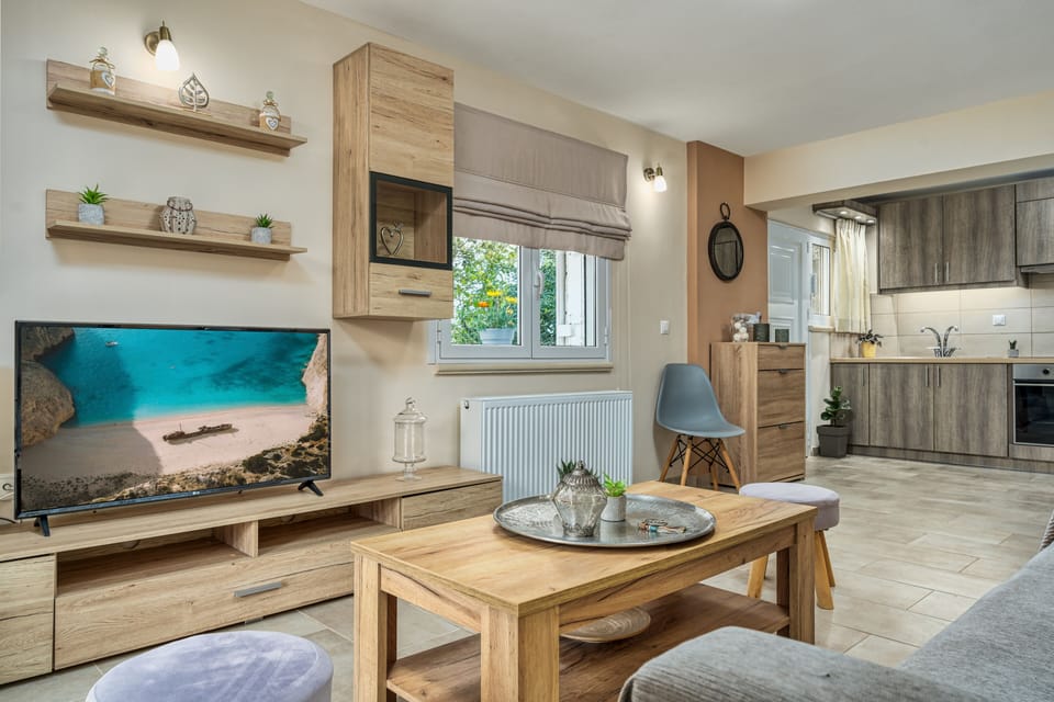Luxury Apartment | Living area | 32-inch Smart TV with satellite channels, TV, printers