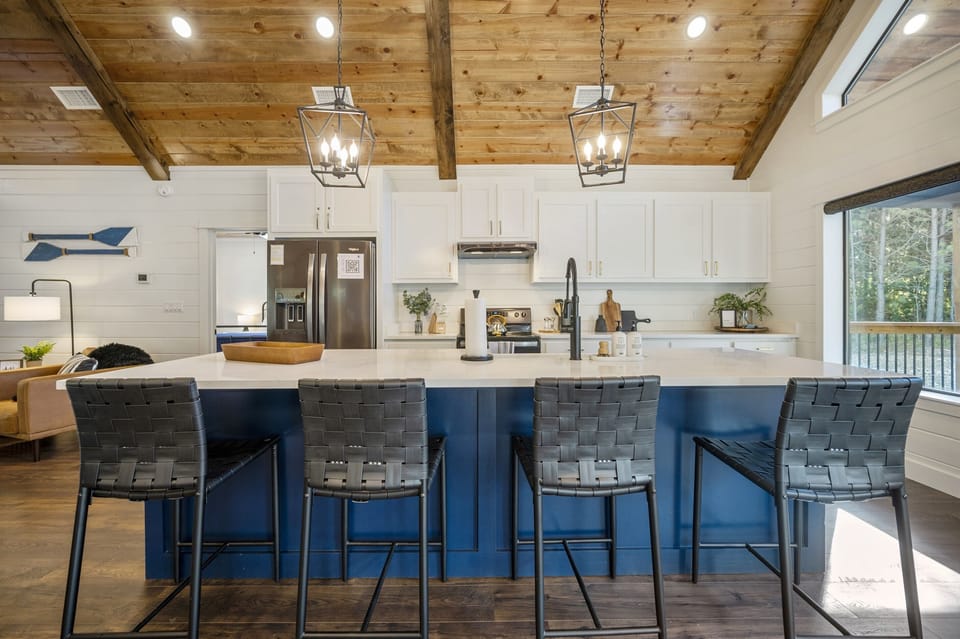 "Gather with loved ones around the oversized island with seating for four in our kitchen."