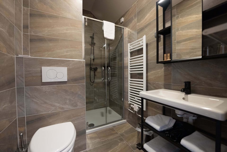 Attic double room | Bathroom | Hair dryer, slippers, towels