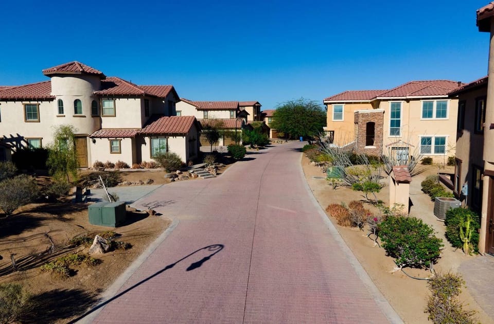 This view shows the area side of Condo 224, offering easy access to the community pool and a quiet setting within this gated El Dorado Ranch community.