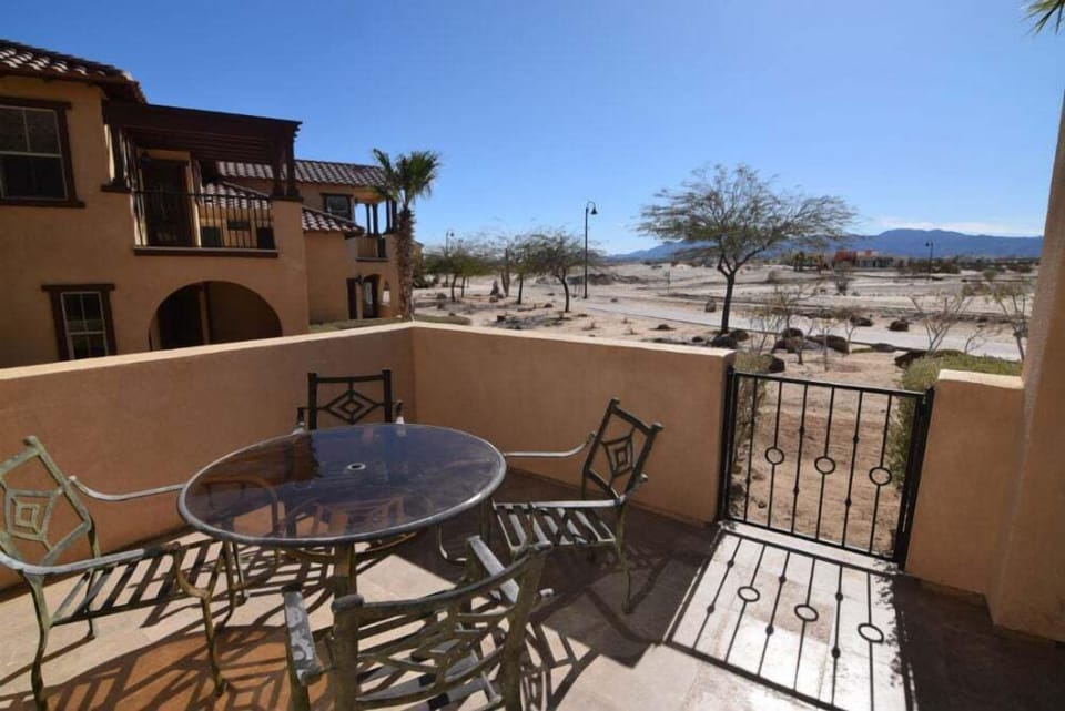 The backyard patio at Condo 234 offers a private outdoor space with seating — perfect for enjoying the Baja weather in this El Dorado Ranch vacation rental.