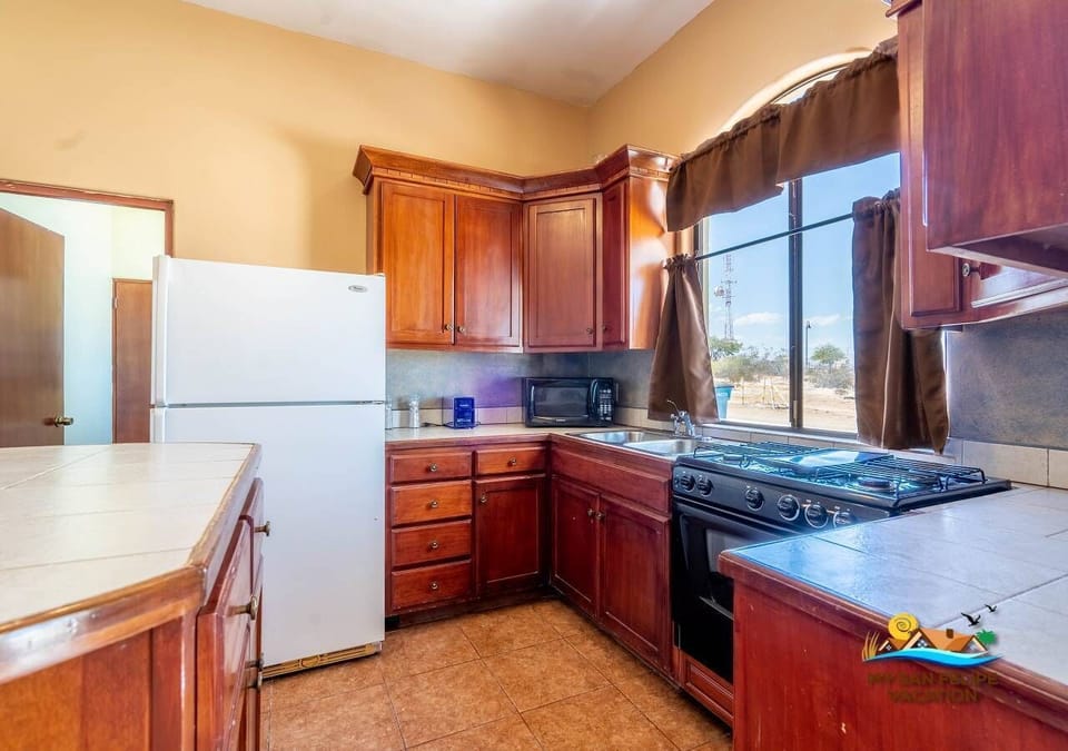 Casa Tapia features a fully equipped kitchen with a full-size refrigerator, dishwasher, microwave, oven, and stove. Perfect for preparing meals during your stay