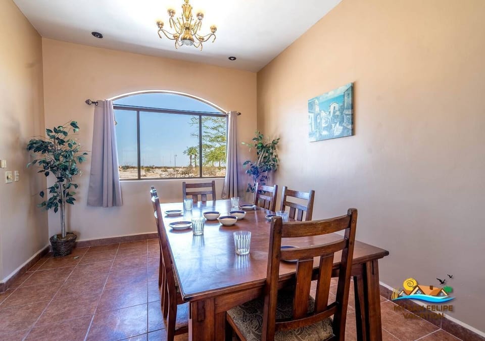 The dining room setup at Casa Tapia is conveniently located right next to the kitchen.