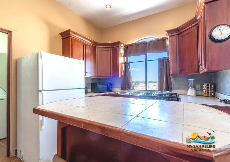 The kitchen at Casa Tapia comes equipped with a full-size refrigerator , perfect for keeping groceries and drinks cold during your beach stay.