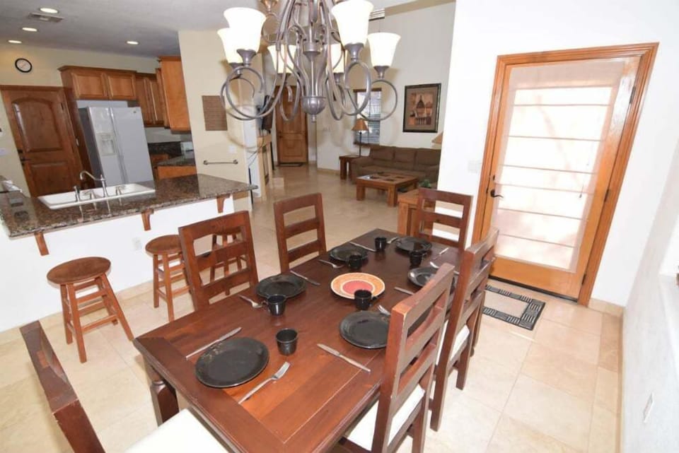 The large dining area connects directly to the kitchen, making meals easy to serve and enjoy with the group
