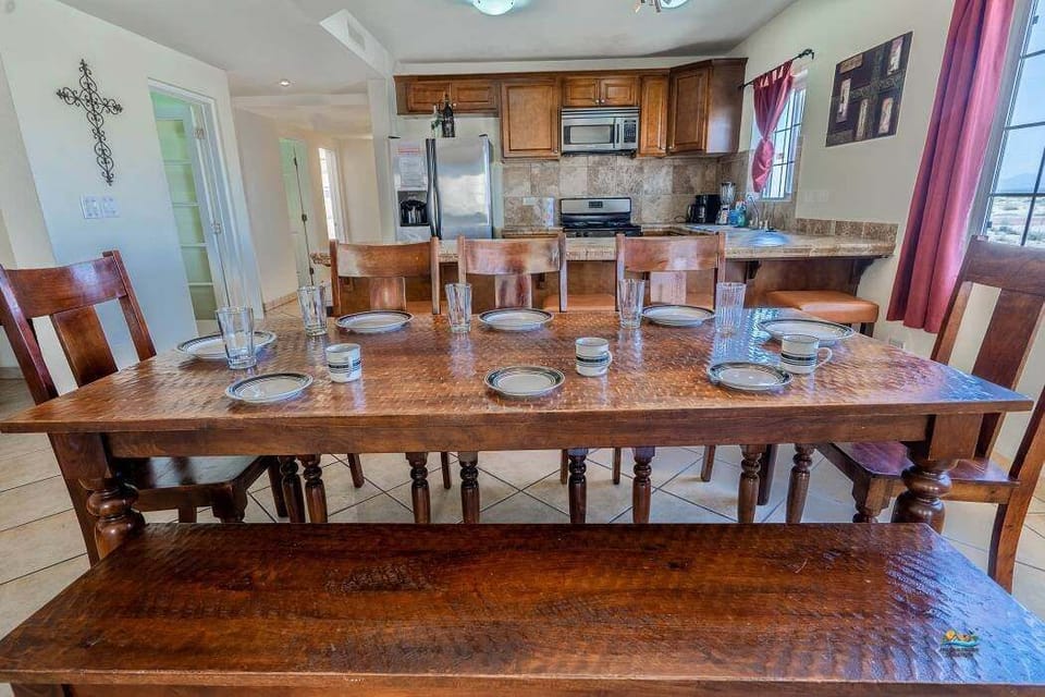 See the dining table from the side at Casa Monterrey in La Hacienda San Felipe BC MX — showing seating capacity and placement.
