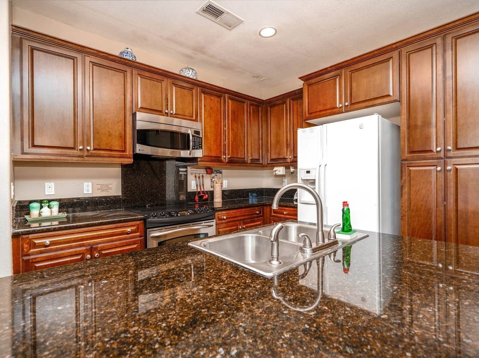 This fully equipped kitchen features a full-size refrigerator — perfect for keeping groceries and drinks