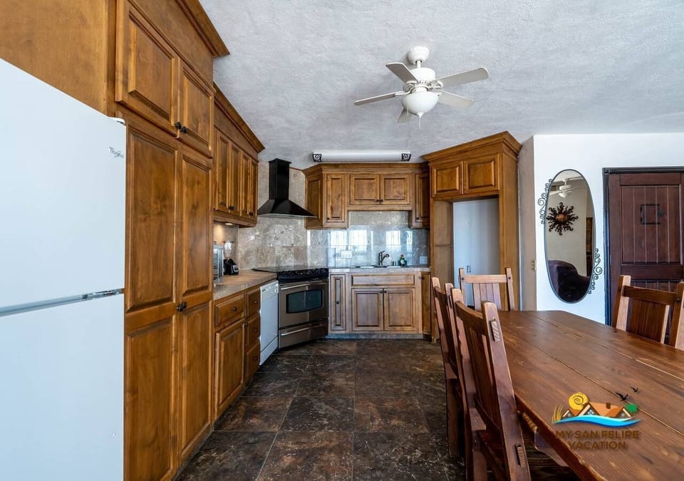 Full kitchen at Casa Las Palmas in the Las Palmas community of San Felipe — stove, fridge, and counter space included.