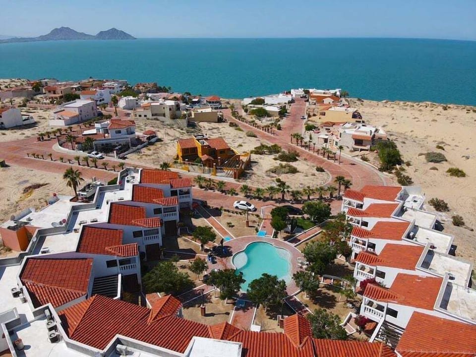 La Hacienda 7 in San Felipe B.C. vacation poolA shimmering community pool area featuring clear blue water and ample space for sunbathing, offering a perfect oasis for guests to relax and soak up the Baja sunshine.