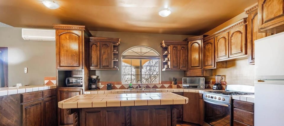 Cook meals with ease in the full kitchen at Casa Gardenia in El Dorado Ranch San Felipe Baja California Mexico — stove, fridge, and counter space included.