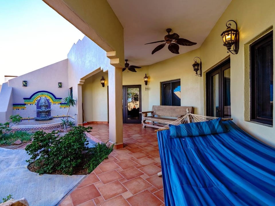 String up a hammock between two palm trees on the outdoor patio at this El Dorado Ranch rental in San Felipe Baja California —