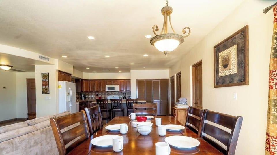 Seamless flow from the dining table to the fully equipped kitchen. Includes refrigerator, oven, and microwave — perfect for group meals.