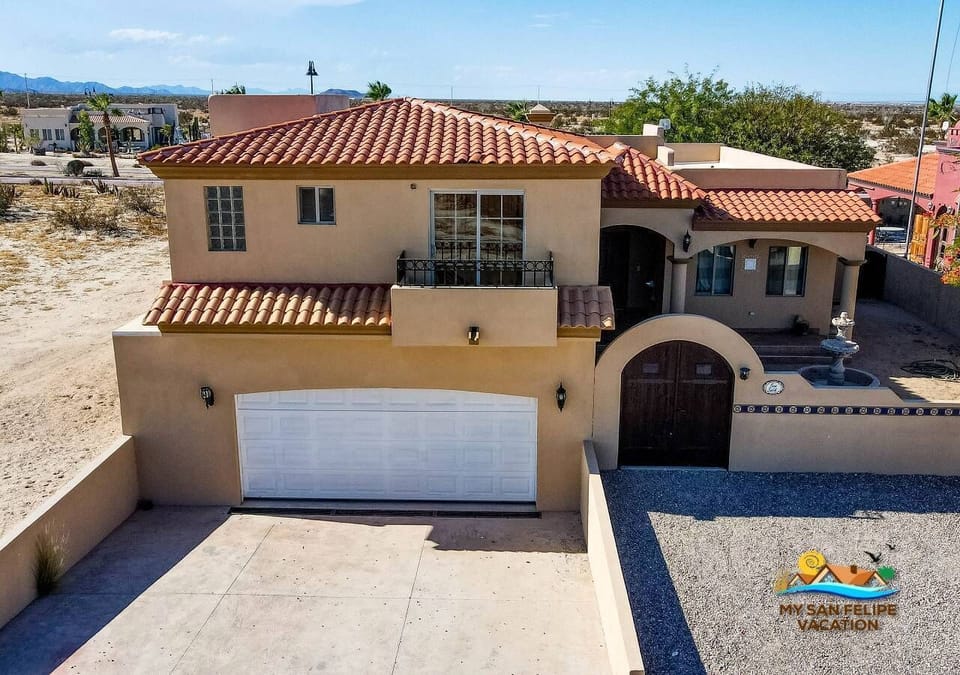 Step through the front entrance into a modern-contemporary living room with comfortable sofas and a flat-screen TV with Dish connection