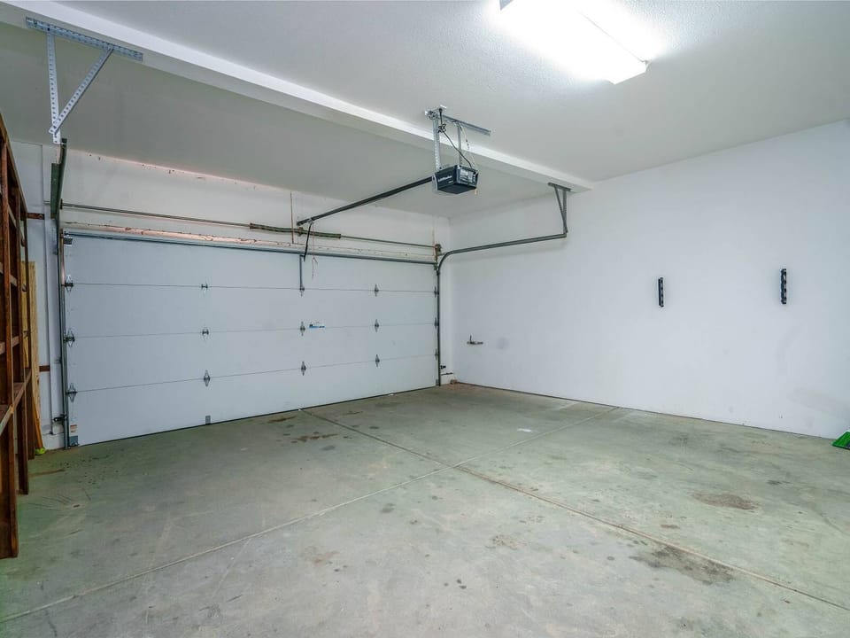 This attached two-car garage provides secure covered parking for guests — keep your vehicle out of the sun safely during your beach vacation.