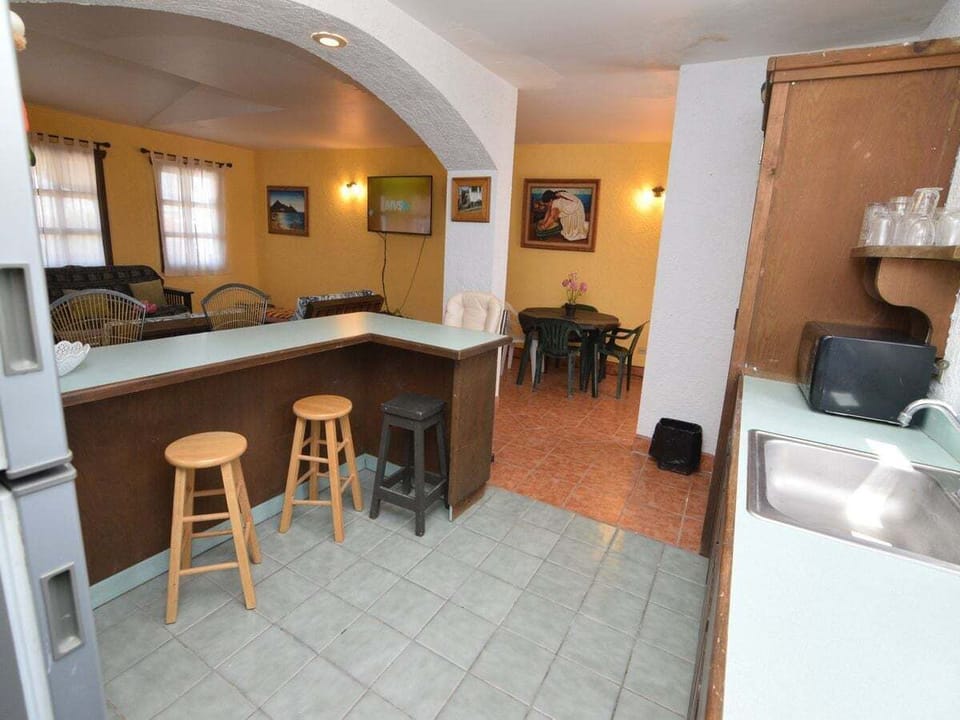 The kitchen includes a dishwasher and microwave — part of this 2‑bedroom, 2‑bath vacation rental with a private balcony
