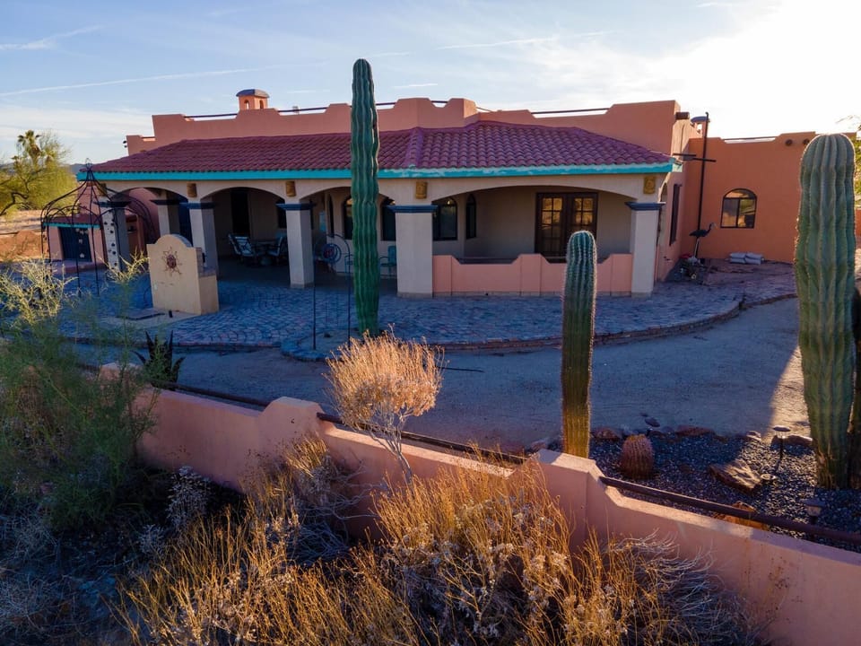 The back right area of Casa Zur Heide features the spacious patio with a built-in BBQ, grill, fire pit for s'mores, and multiple seating areas — perfect for outdoor dining and relaxing evenings