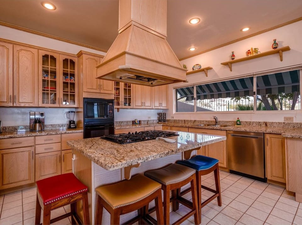 Prepare fresh meals in the full kitchen of this San Felipe BC beach house rental — stove, fridge, and ocean views included.