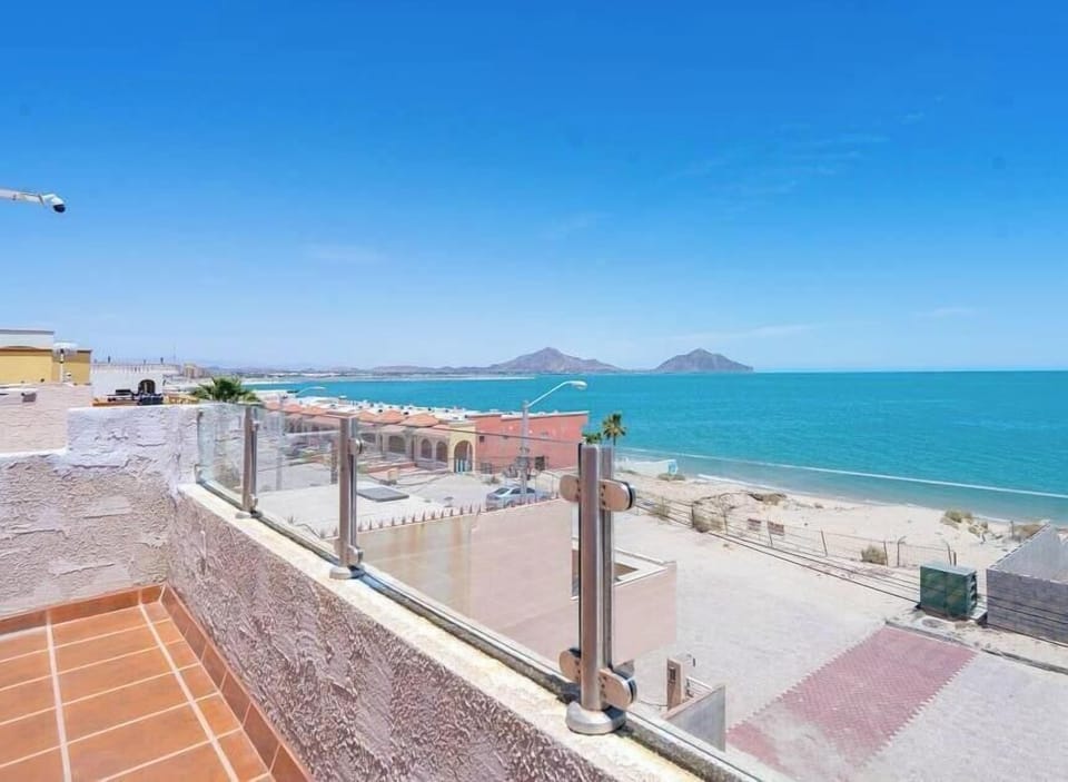 Climb to the expansive rooftop deck at Casita de Playa and look over surrounding homes to the Sea of Cortez — rope lights keep the space glowing for evening relaxation