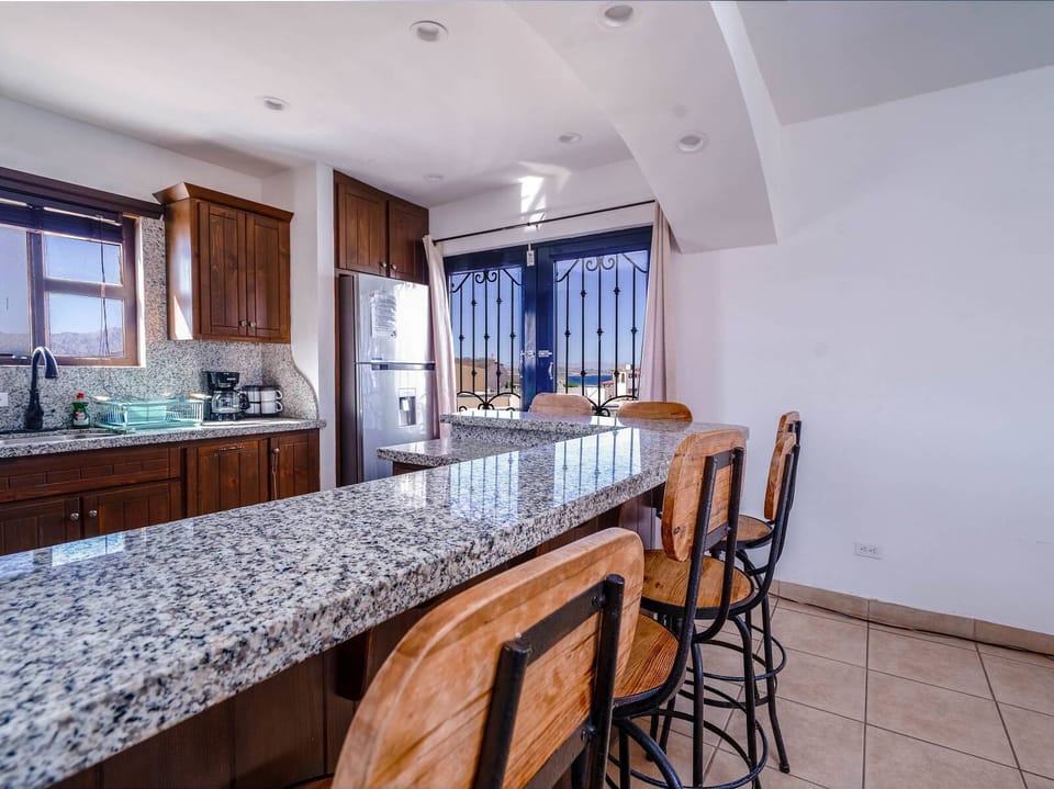 A modern, full-sized refrigerator with ample space to store all your groceries, drinks, and fresh local ingredients during your stay.