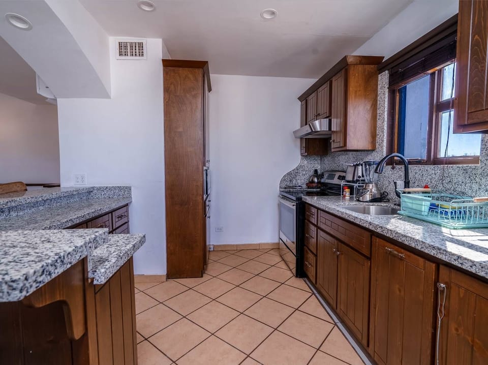A fully equipped modern kitchen featuring quality appliances and all the essentials needed to prepare delicious meals during your getaway.