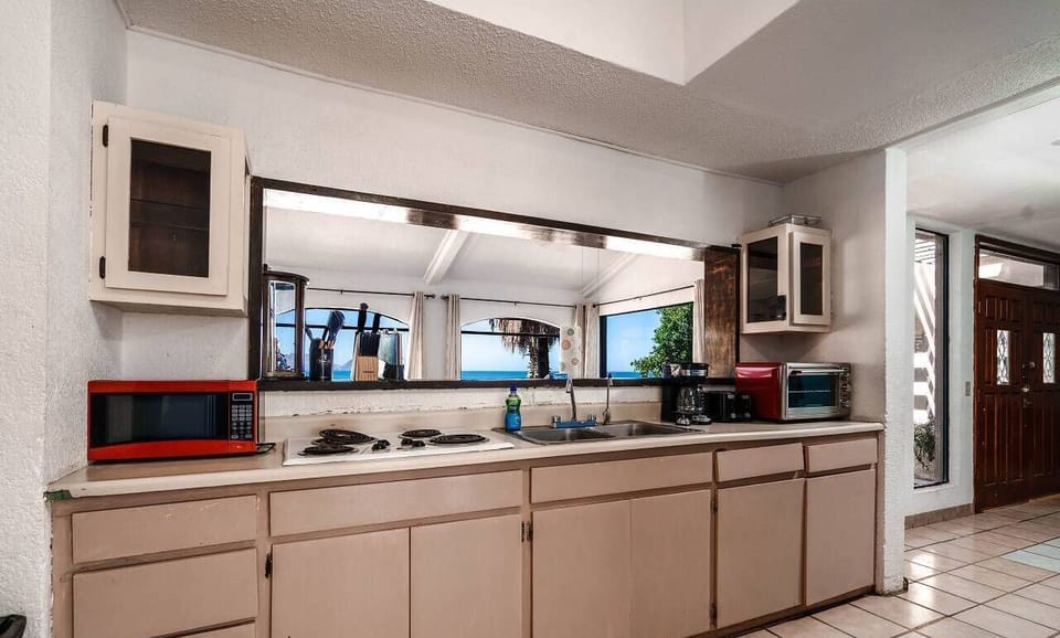 Cook meals with ease in the full kitchen at Casa Julieta inside La Hacienda San Felipe BC MX — stove, fridge, and counter space included.