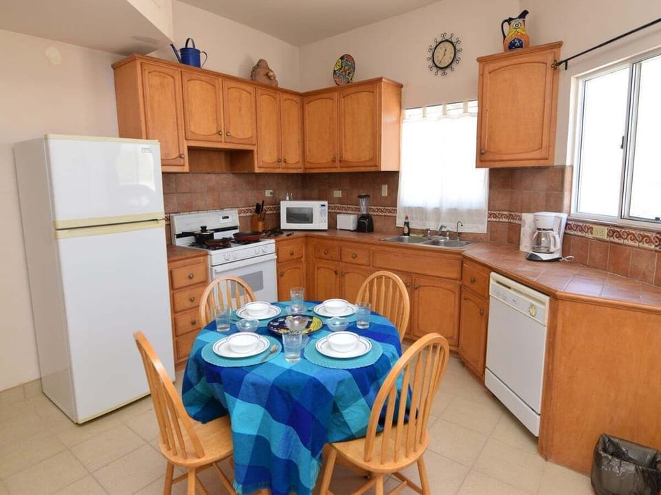 Cook with ease in the full kitchen of Casa Magers at El Dorado Ranch San Felipe — stove, fridge, and counter space included.