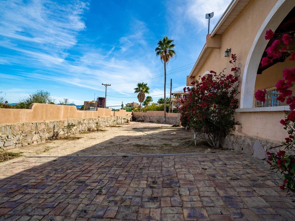 The lower unit's private patio at Casa Vista del Mar includes a BBQ grill and access to the oversized garage — perfect for outdoor cooking and relaxing after the beach .