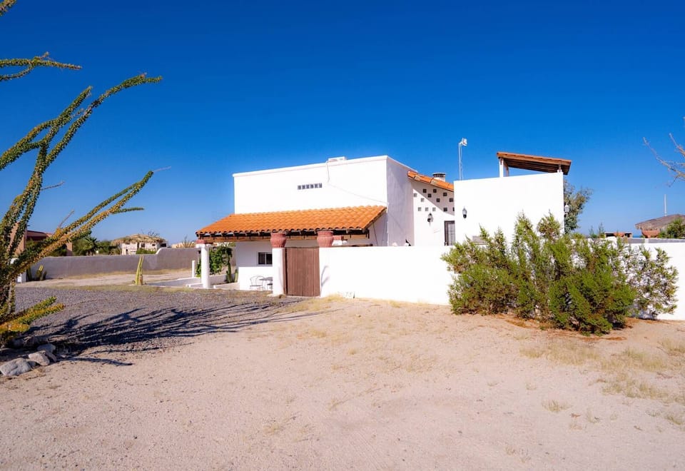 See the welcoming front exterior of Casa Palos Verdes in El Dorado Ranch San Felipe BC — entrance, parking, and curb appeal.
