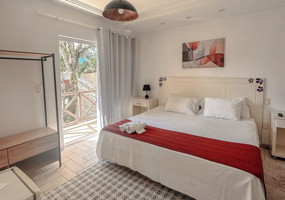 Suíte Deluxe | Minibar, laptop workspace, iron/ironing board, free WiFi