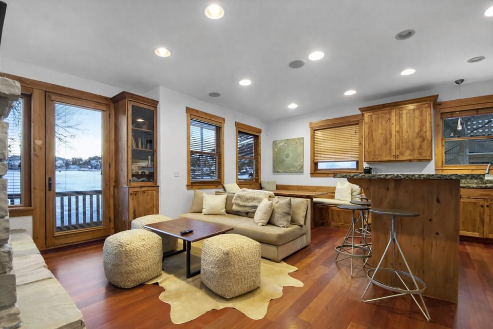 Unwind in this charming space with a plush sectional and an inviting atmosphere. Enjoy the stunning water views and step out onto your private balcony for some fresh air.