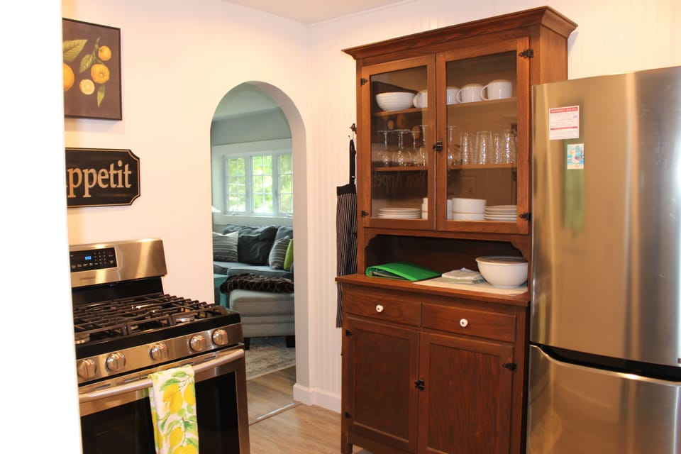 View from the mudroom into the kitchen with a view of the living/dining room 