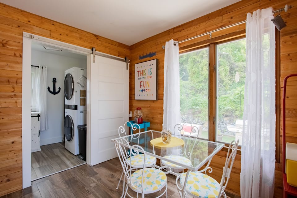 Sunroom leads to laundry and main bathroom & has great views of sunny backyard.