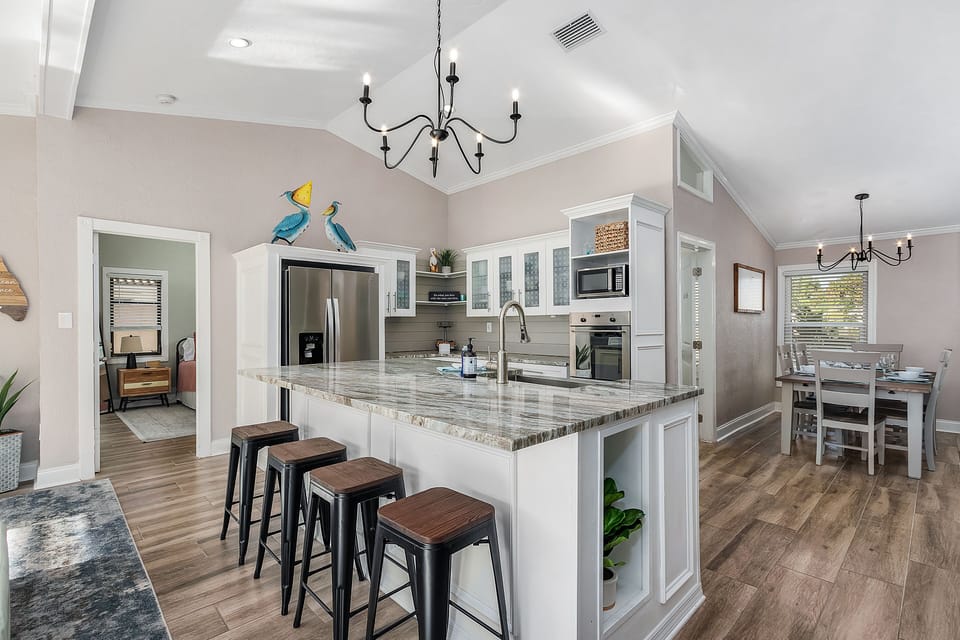 Kitchen with all stainless-steel appliances and central island.