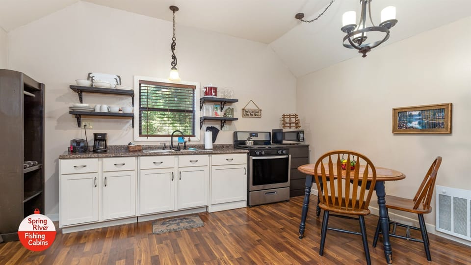 Full kitchen, with drip coffee maker, crock pot, toaster, microwave, full fridge, and gas stove. 
