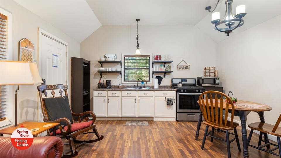 Full kitchen, with drip coffee maker, crock pot, toaster, microwave, full fridge, and gas stove. 
