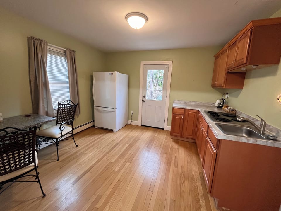 Back entrance into stocked kitchen area on first floor