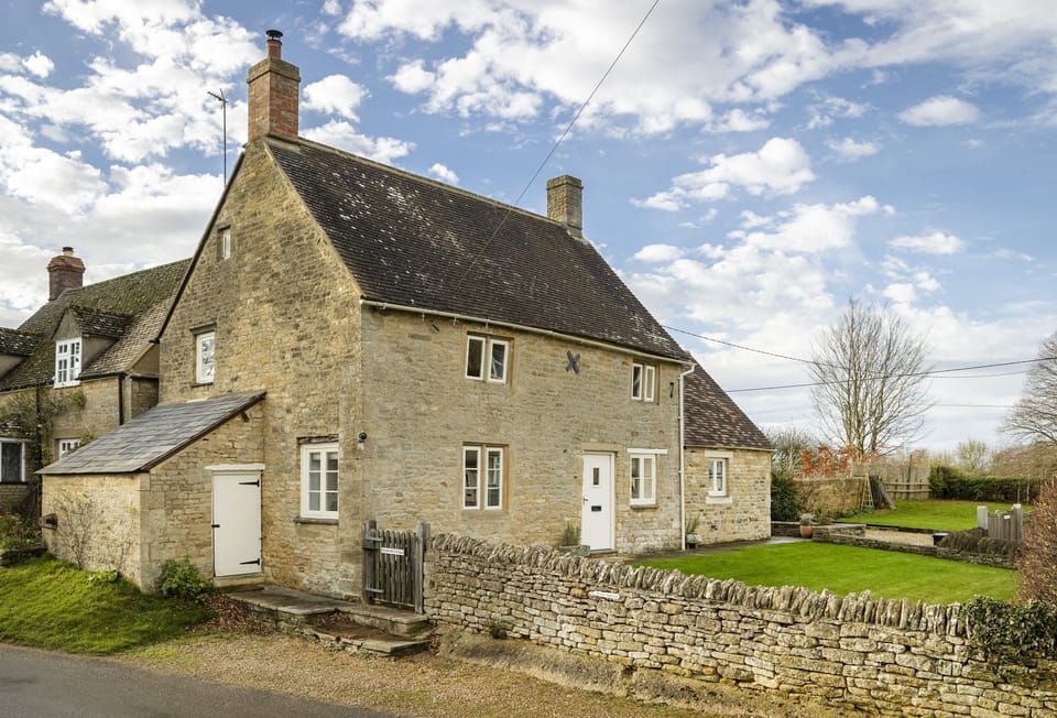 Shepherd's Cottage: Parking area with external steps up to the garden path and entrance