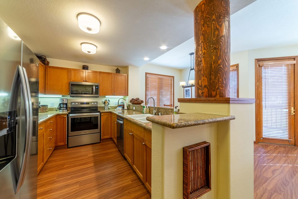 Beautiful kitchen with stainless steel appliances and granite countertops.
