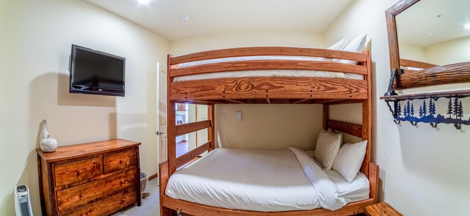 Bedroom 2 with dresser and closet space.