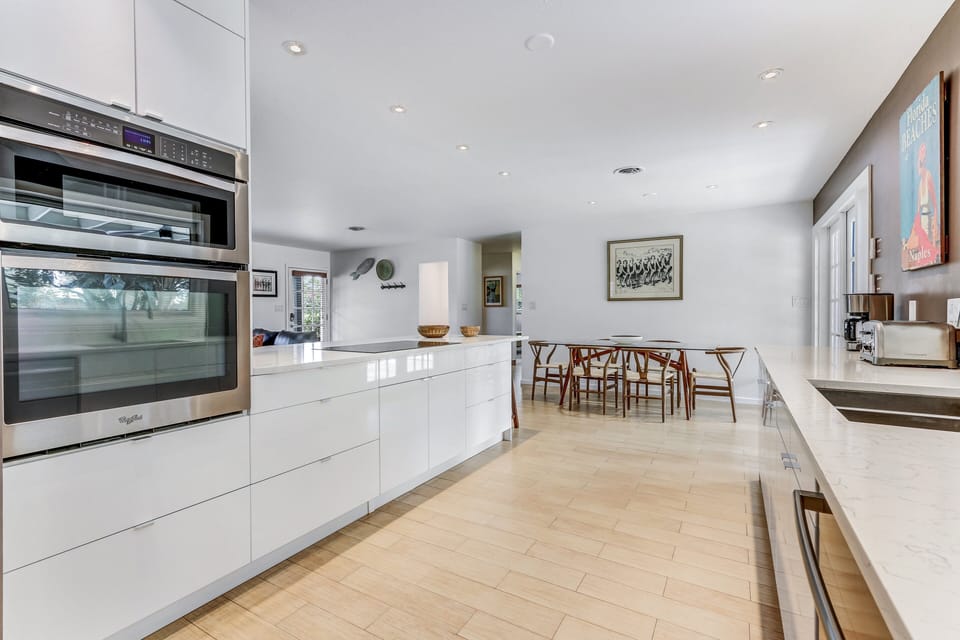 Top-of-the-line kitchen appliances include a built-in microwave oven