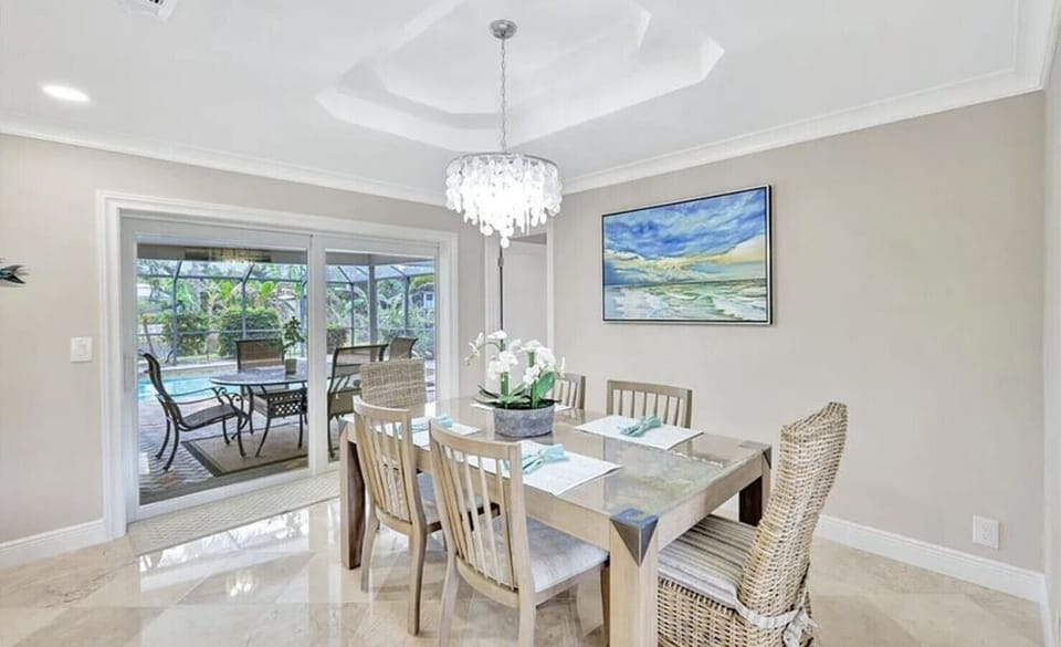 Elegant dining with views and easy access to the lanai