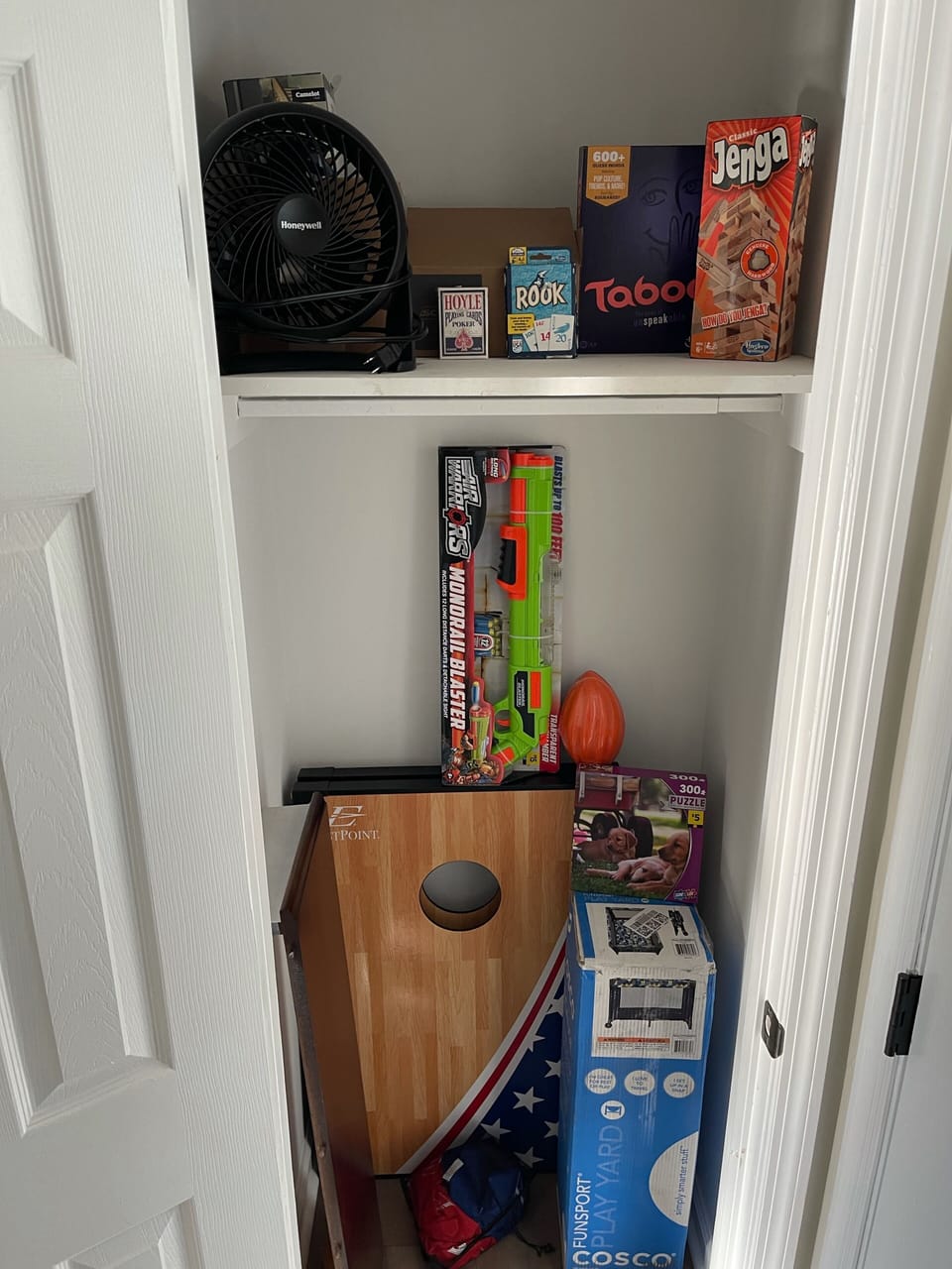 Various playing cards & card games, Cornhole, puzzles, football and pack n play.