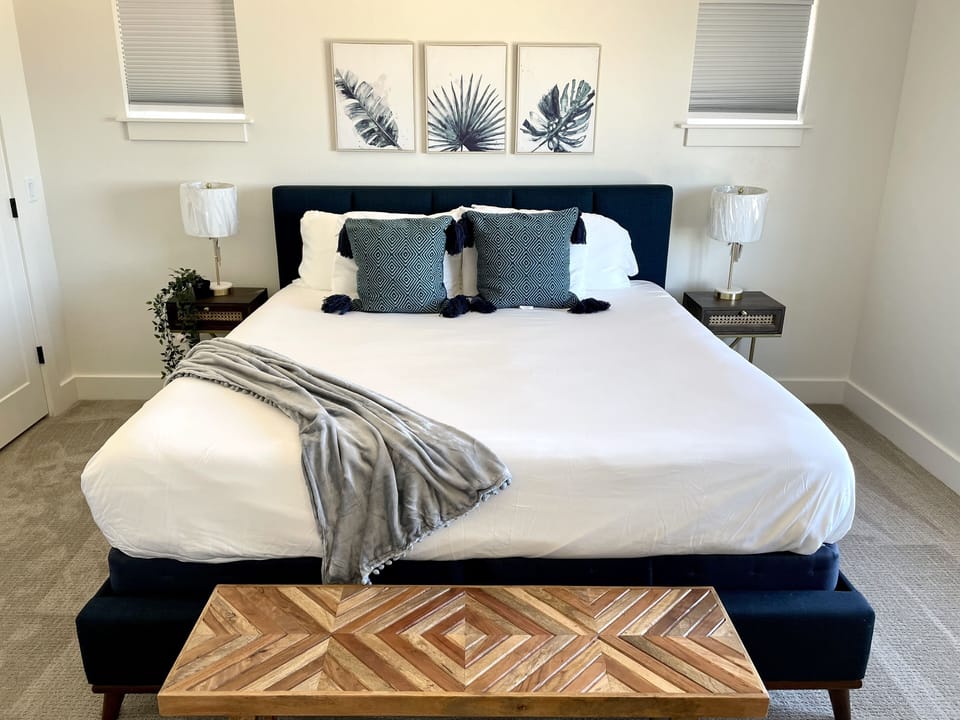Main floor primary suite. En suite bathroom. Lake view from bed.