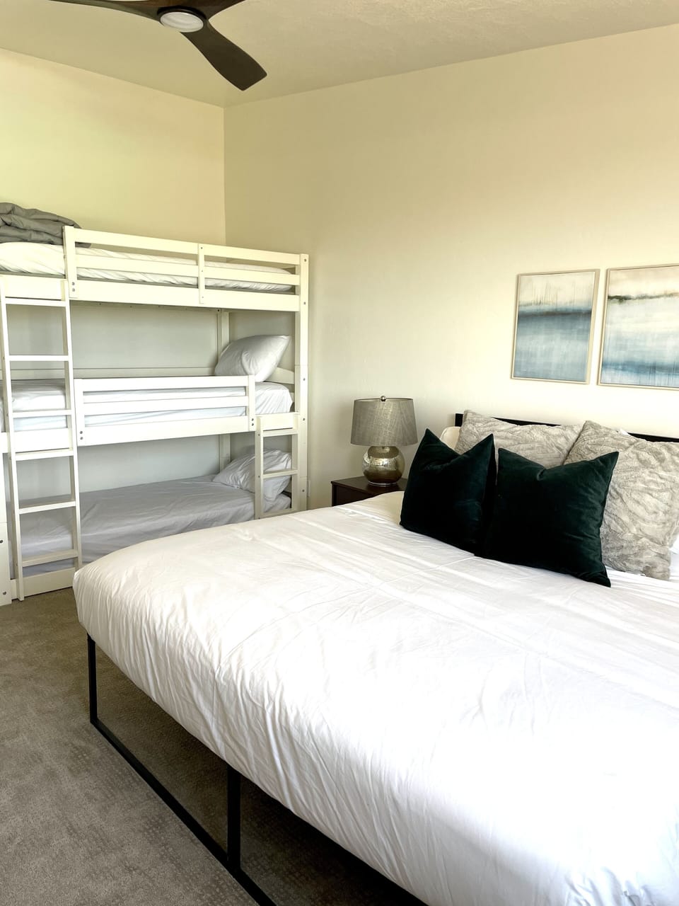Upstairs north west bedroom with king bed and triple bunk. Sleeps 5
