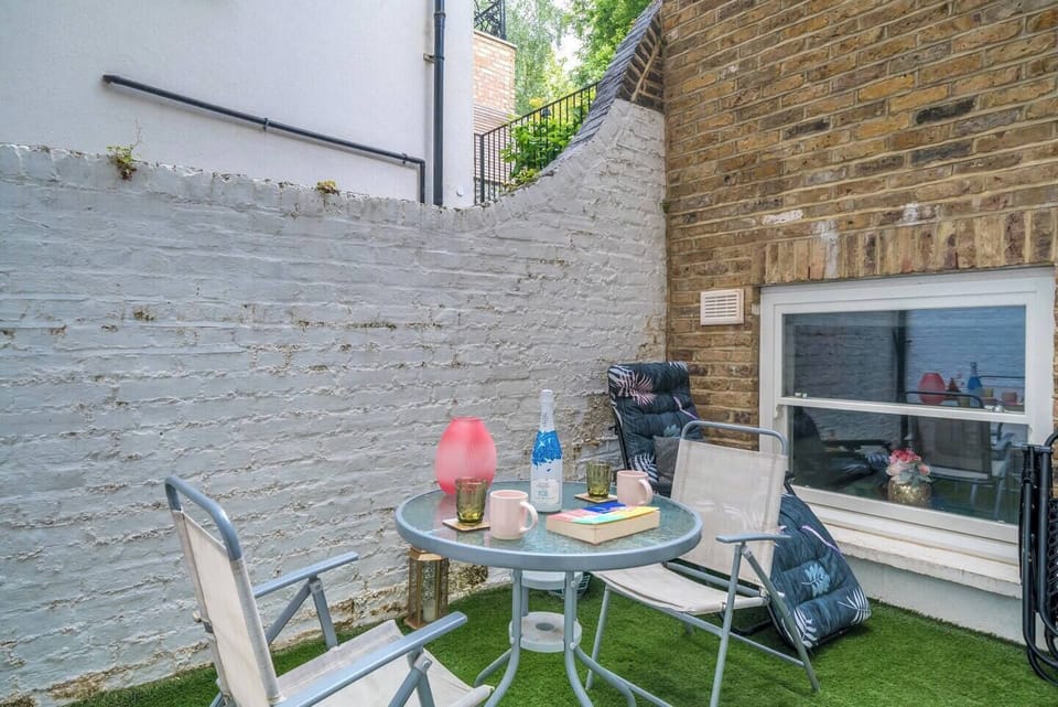 The patio provides a serene and inviting space for relaxation, socializing, or simply enjoying a peaceful moment.